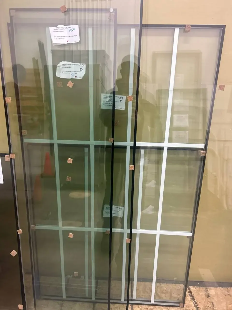 Manufactured insulated glass units with spacer edges, labels, and decorative grids.