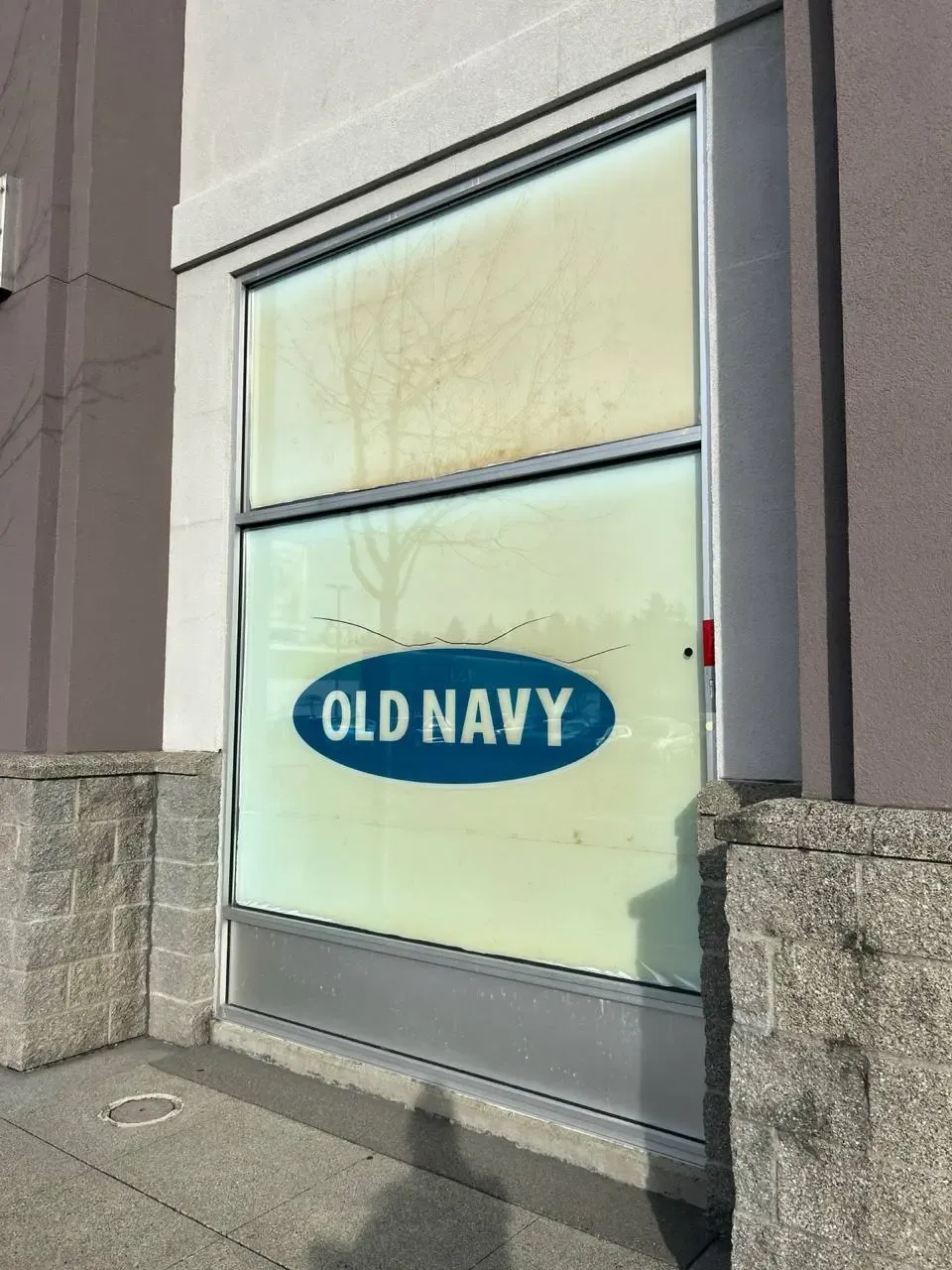 Commercial display window with a crack across the lower pane
