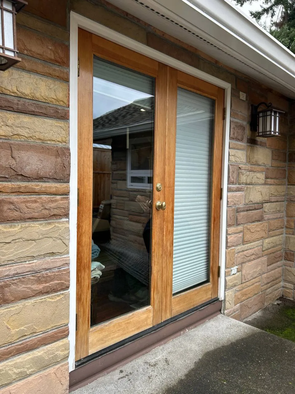 Clear glazing in the matching timber doorway, photographed from outside.