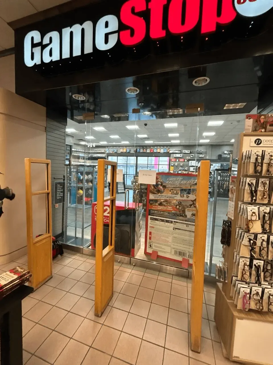 Retail storefront with a glazed entrance and surrounding display panels
