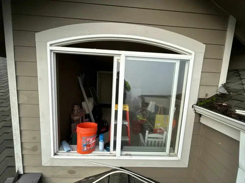 An exterior view of the opening and tools during window work.