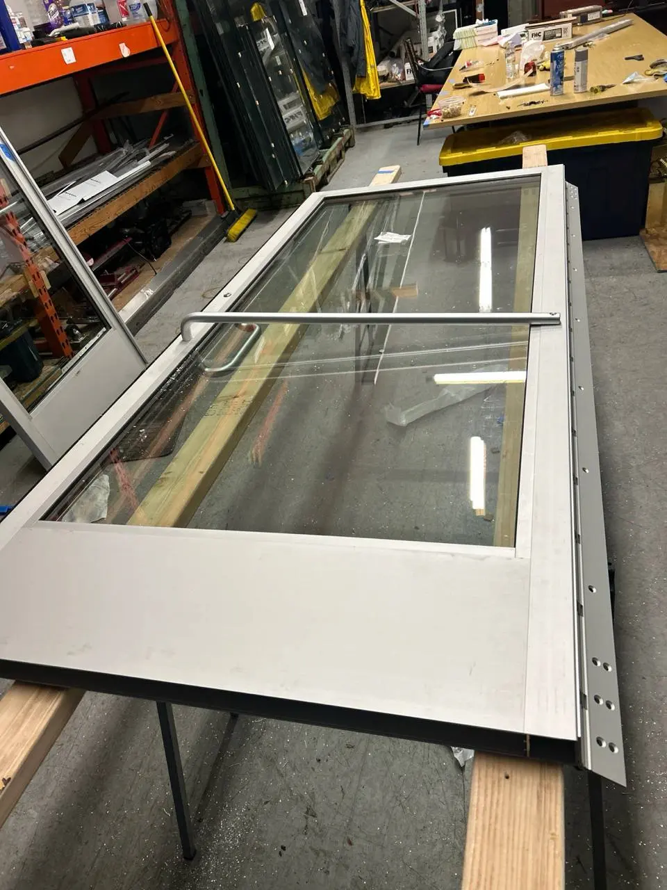 Commercial aluminum entrance with replacement glass prepared for installation