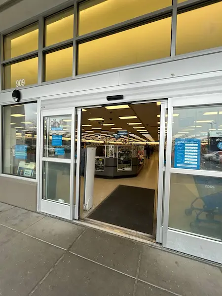 opened automatic commercial door with glass
