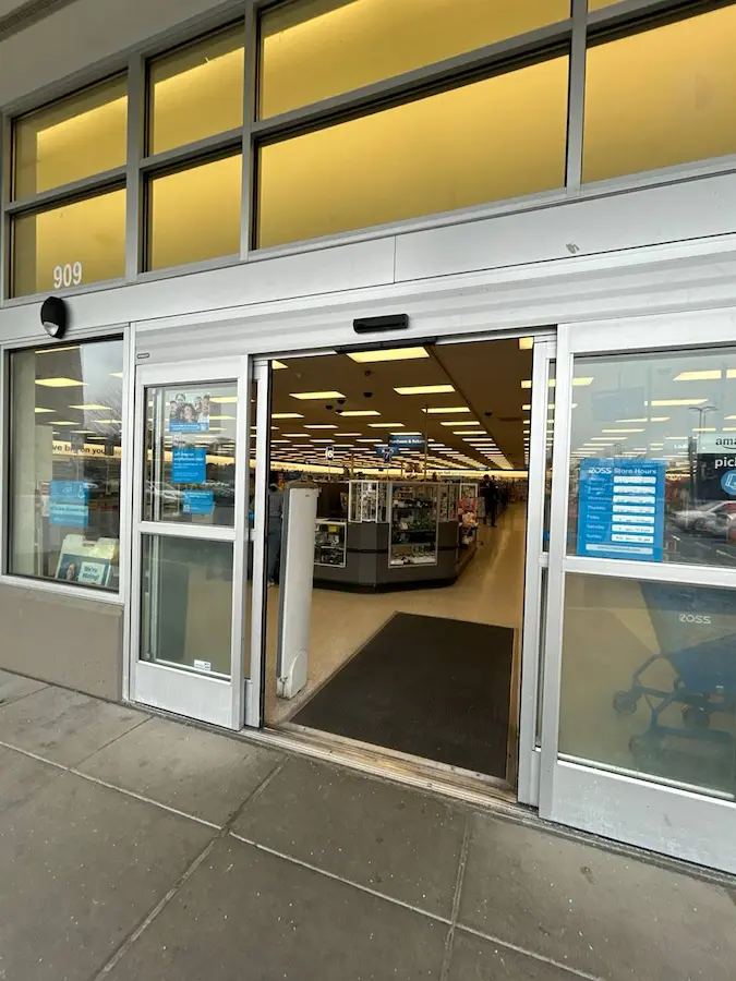 opened automatic commercial door with glass