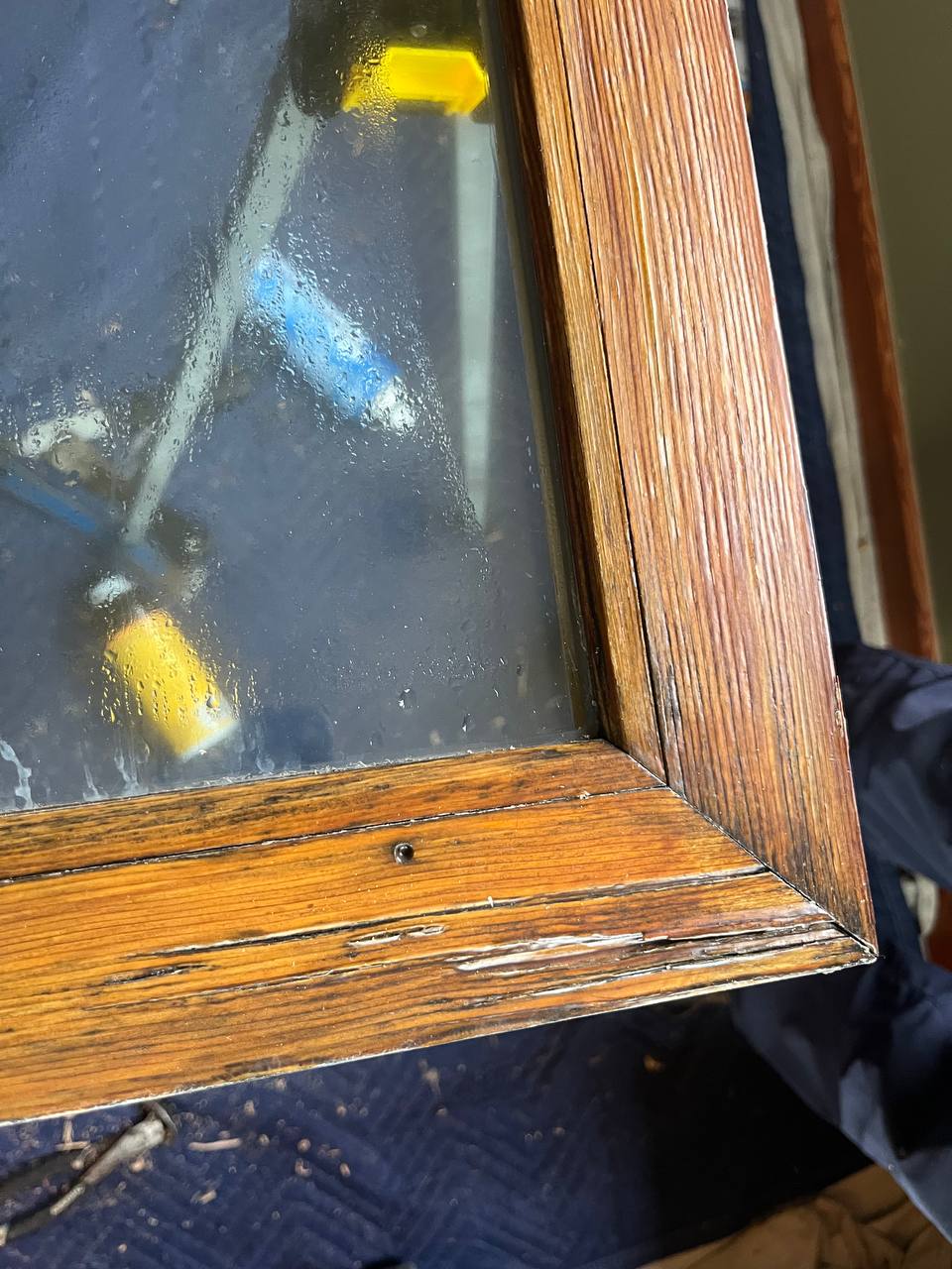 foggy window with cracked frame