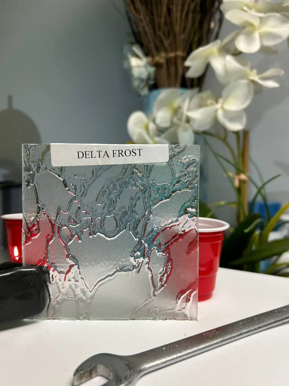 Decorative obscure glass with flowing raised texture for privacy and visual movement.