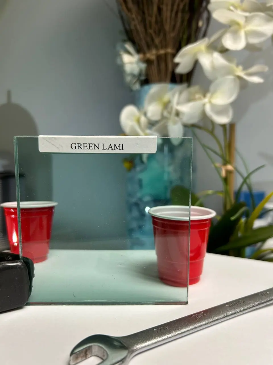 Green laminated glass with a cool tint for safety panels and subtle color control.