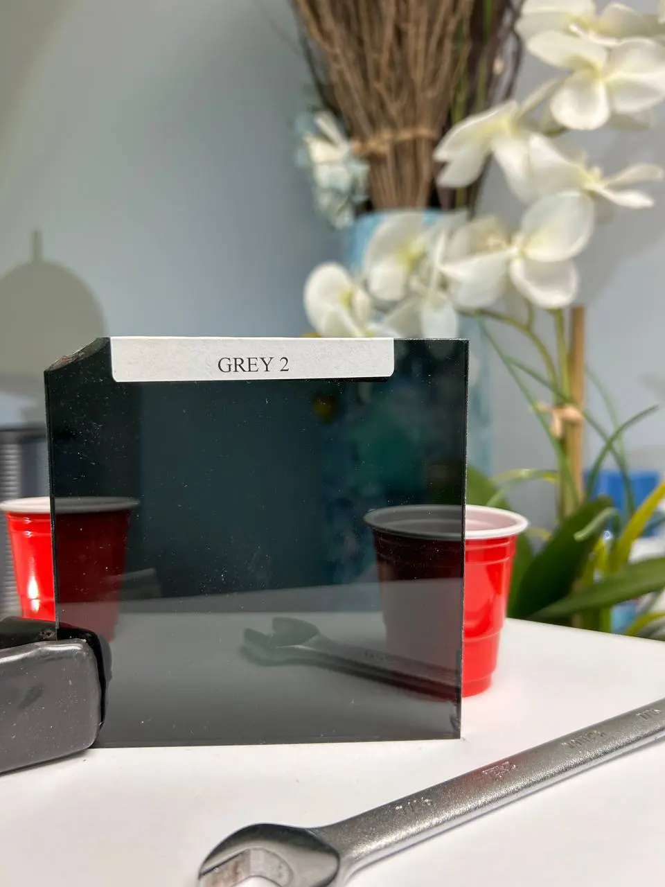 Deep grey tinted glass for stronger glare control, privacy, and a darker modern look.